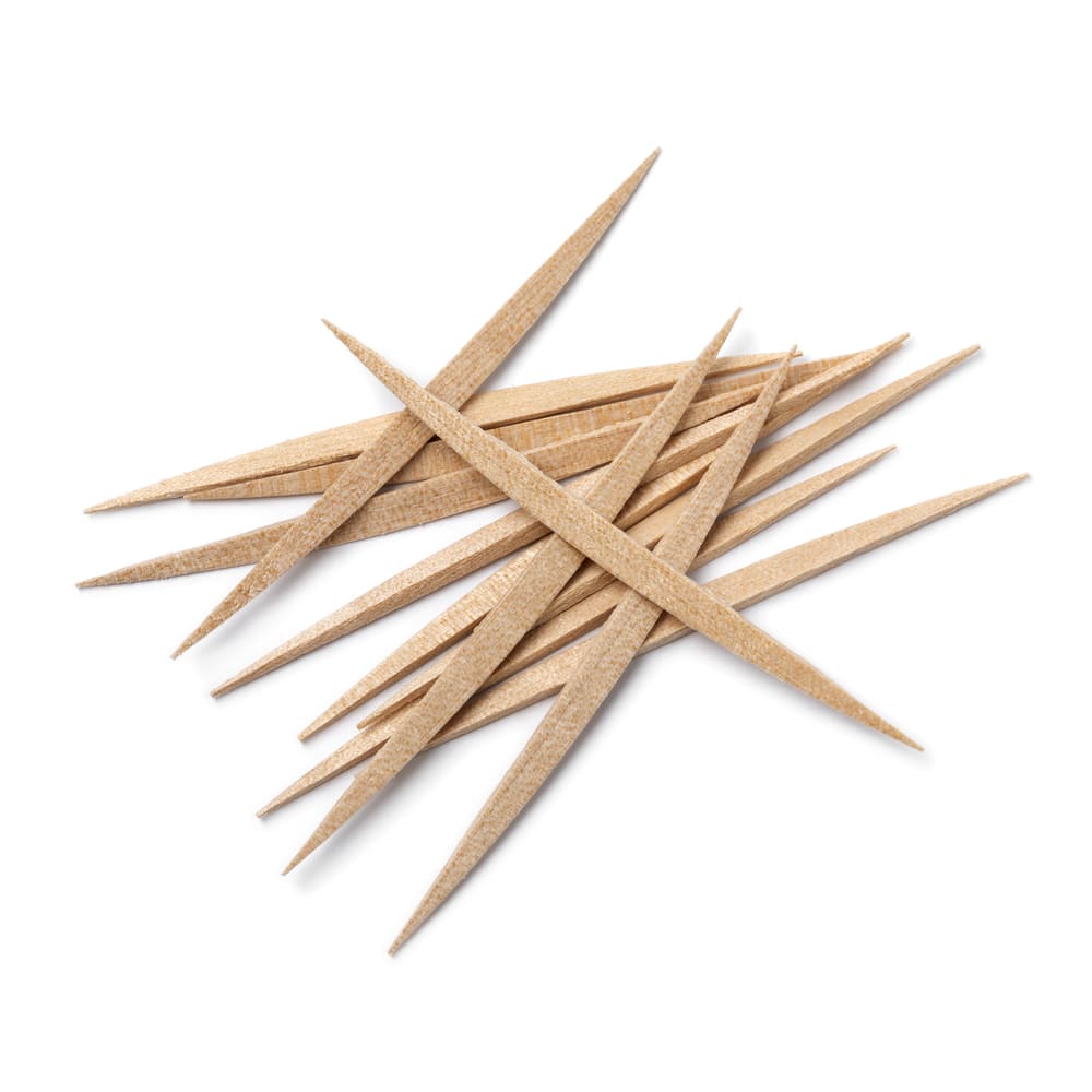 Una imagen de varios palillos de madera amontonados unos por encima de otros. 