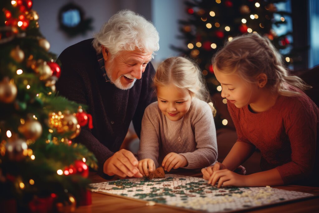 abuelo con nietas haciendo decoraciones de navidad 